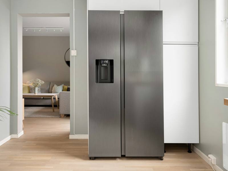 Stainless steel side-by-side refrigerator in a home kitchen
